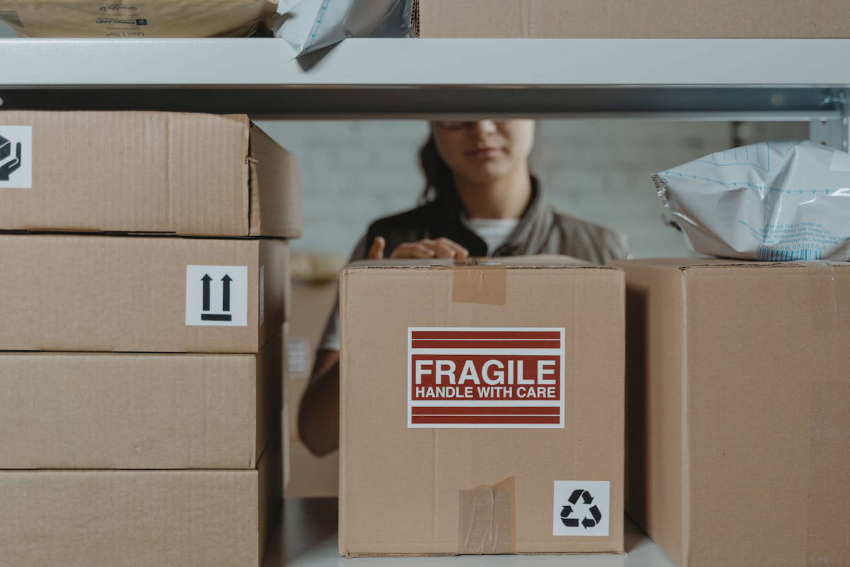 A woman packaging boxes