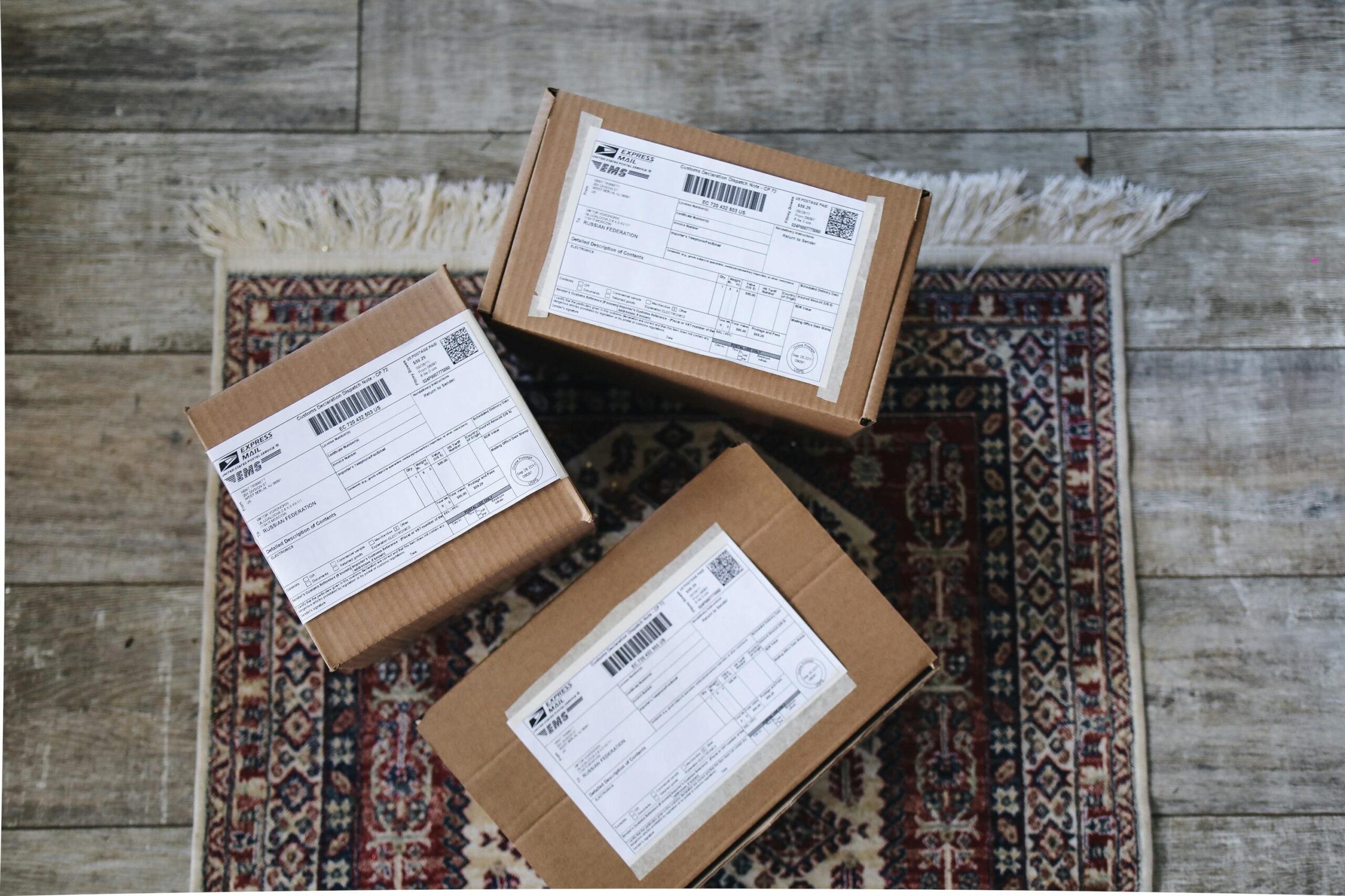 three packages on a rug